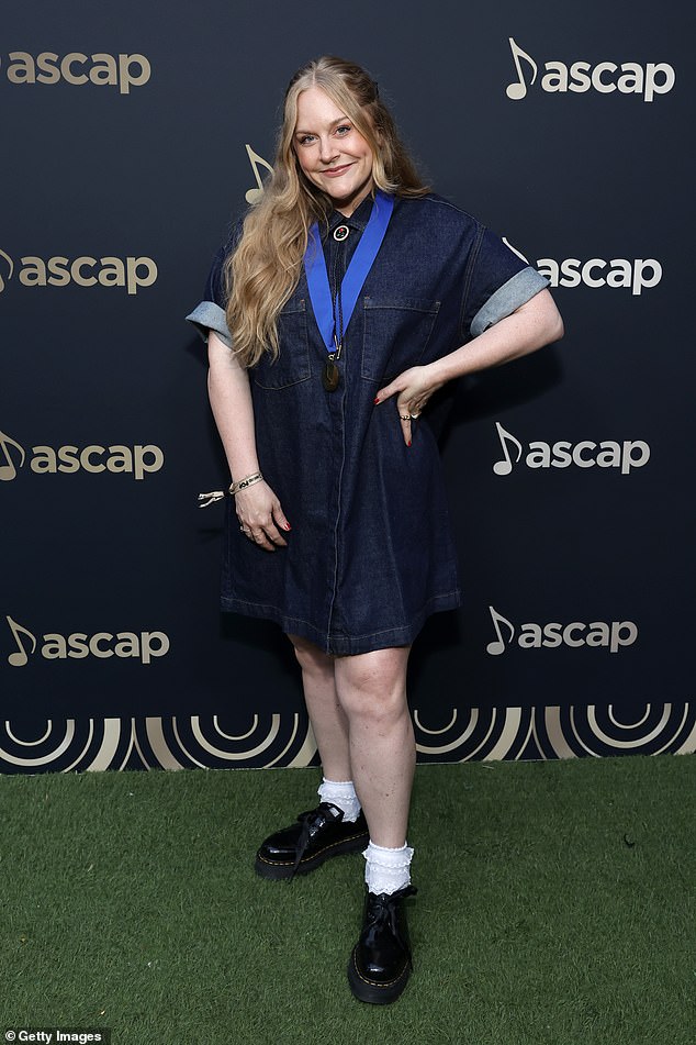 Steph Jones, who has written songs for Sabrina Carpenter and Selena Gomez, showed off her medal for cameras after the ceremony.