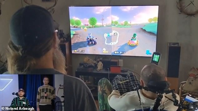 Arbaugh can move a cursor around the screen using the remote brain chip in his head. He likes to play Mario Kart (pictured) with friends.