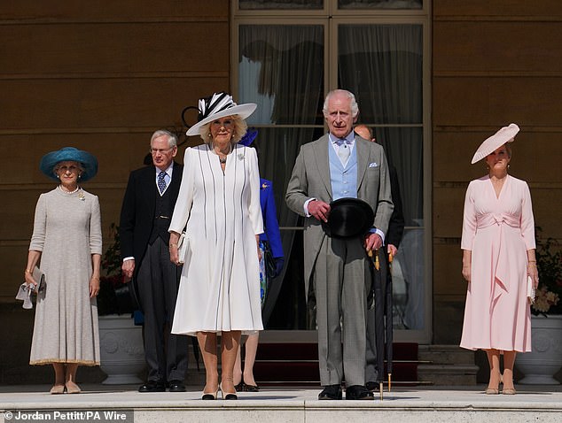 King Charles III and Queen Camilla join the Duke and Duchess of Edinburgh (right) and the Duke and Duchess of Gloucester (left) for the garden party at Buckingham Palace today