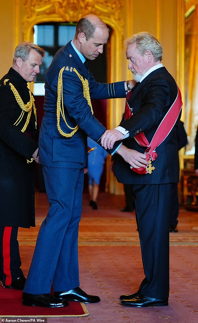 Film director Sir Ridley Scott receives the Knighthood Grand Cross at Windsor Castle from William today.