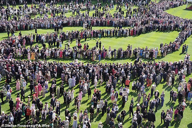 Guests attending the royal garden party at Buckingham Palace in London this afternoon