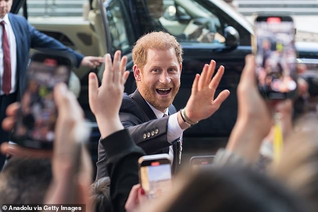 The Duke of Sussex greets his fans as he leaves St Paul's Cathedral after the service yesterday.