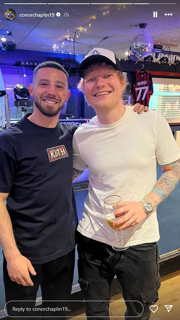 Conor Chaplin (left) was keen to have his photo taken with the devoted Tractor Boys fan.