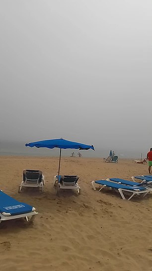 Tracy Stocks and her husband decided to travel to Benidorm in search of sea and sun, but the couple were left confused when this thick fog (pictured) appeared on Sunday May 5 and enveloped the beach while they were supposed to be sunbathing.