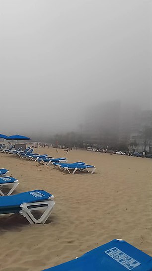 Tracy Stocks and her husband decided to travel to Benidorm in search of sea and sun, but the couple were left confused when this thick fog (pictured) appeared on Sunday May 5 and enveloped the beach while they were supposed to be sunbathing.