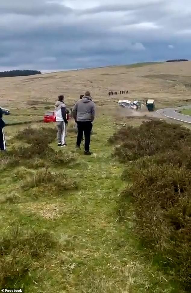 When it makes contact, a spool of white toilet paper can be seen exploding as it hits the ground, unraveling against the gorse.