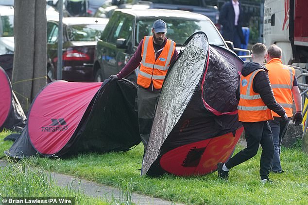 Crews removed tents outside the area, which was closed to pedestrians and cyclists during the operation.