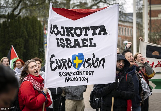 Swedish protesters hold a banner calling for a boycott of Israel at a demonstration in front of Malmo City Hall against the country's participation in the Eurovision song contest.