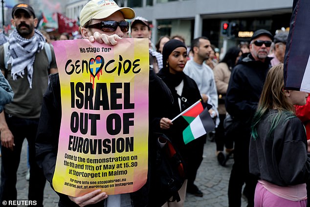 A demonstrator shows a sign during a protest against Israel's participation in the Eurovision Song Contest, before the second semi-final, in Malmo, Sweden.