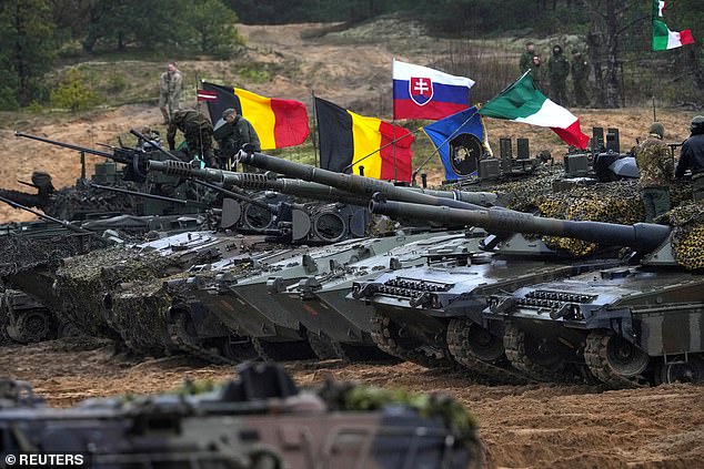 NATO tanks and military vehicles join forces ahead of large-scale exercises