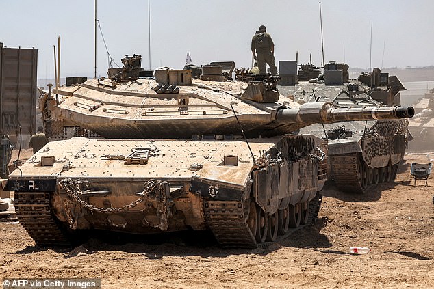 The Israeli army's main battle tanks are positioned in southern Israel, near the border with the Gaza Strip, on May 9, 2024.