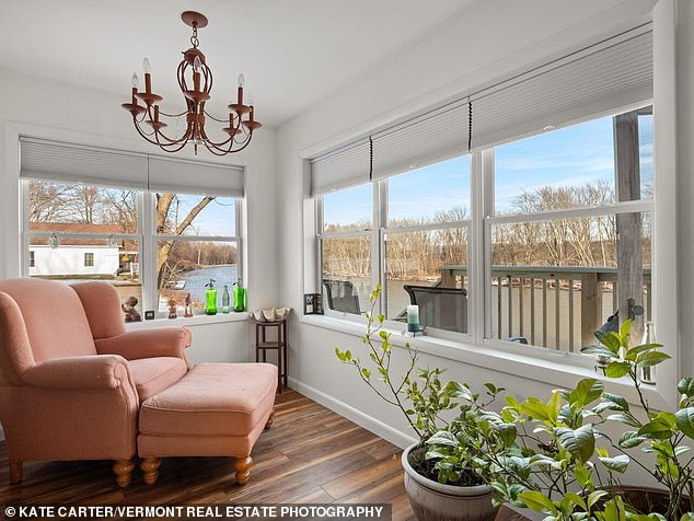 A second relaxing space is to the right, with the kitchen on the other side.