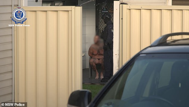 The lovebirds were handcuffed and sitting outside their western Sydney home in nothing but their pajamas.