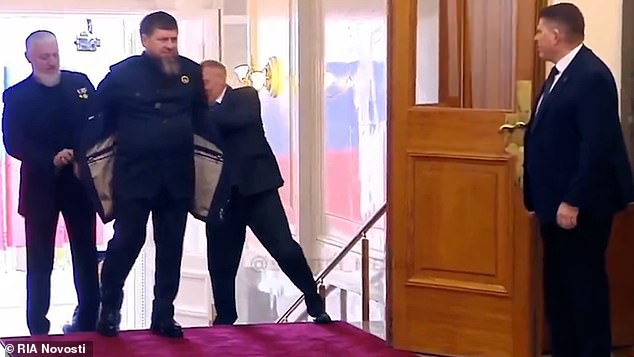 The Head of the Chechen Republic appeared to walk up the stairs into the hallway as he arrived flanked by his assistants, who helped him remove his jacket when they reached the top.