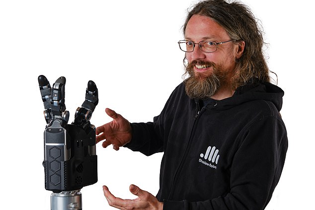 Shadow Robot Company director Rich Waker (pictured) says training AI leads to rapid, random movements that can often tear robots to pieces. This meant they had to design a much larger and stronger option.