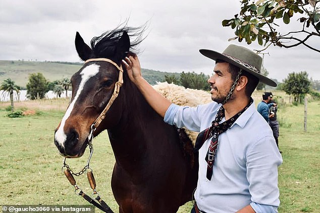 Marcelo Santos, deputy mayor of Santo Antônio da Patrulha, helped rescue a horse (not pictured) from drowning in a flooded street in the municipality of Canoas on Monday.