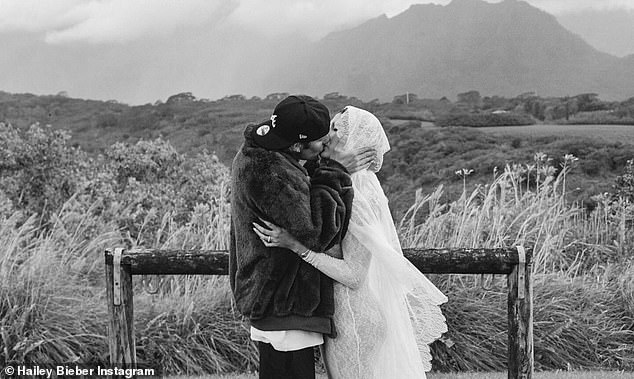 The couple were seen kissing in a field as they celebrated the news.