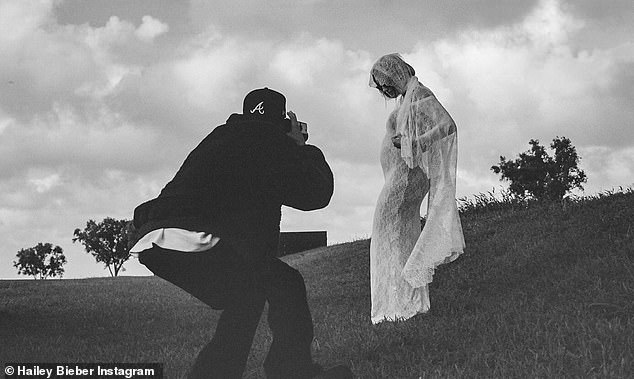 The model, 27, announced the joy of her pregnancy with her husband Justin, 30, with a beautiful session that shows her debuting her baby bump in a white lace wedding dress.