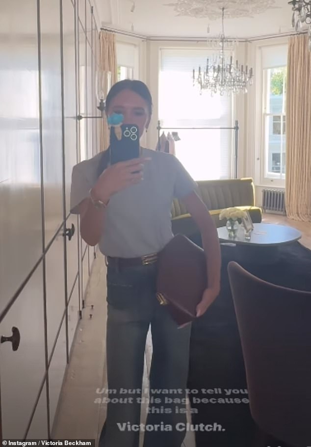 Wearing an oversized gray t-shirt tucked into a pair of coordinating wide-leg denim jeans, Victoria posed for a mirror selfie at her luxurious London home.