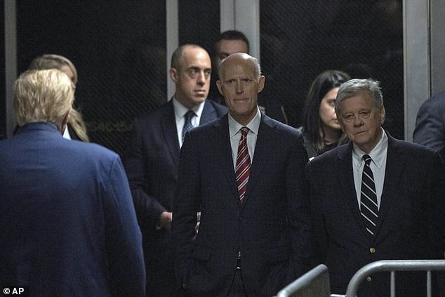 Trump arrived with supporters Thursday morning, including Florida Sen. Rick Scott (center) and attorney John Coale (right), husband of Newsmax host Greta Van Susteren.