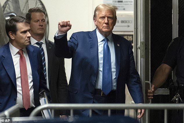 Former President Donald Trump gestures as he walks into the courtroom following a break in his trial in Manhattan Criminal Court on Thursday, May 9, 2024, in New York.