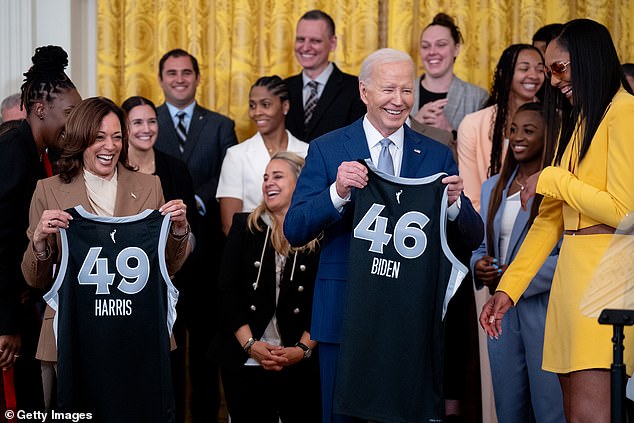 Las Vegas Aces forward A'ja Wilson hands out t-shirts to Biden and US Vice President Kamala Harris