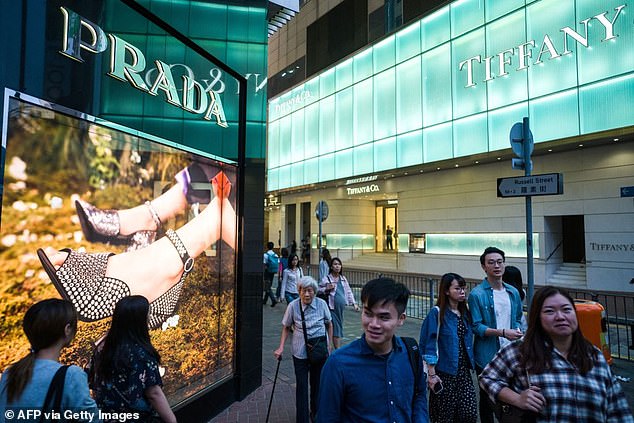 In 2020, the company has continued to shift its focus towards sustainable fashion, introducing eco-friendly lines and sustainability goals. Other changes from tradition have included an emphasis on innovation and global expansion, entering markets like Asia that are booming as mass retailers struggle. In the photo, Prada shoppers in Hong Kong.