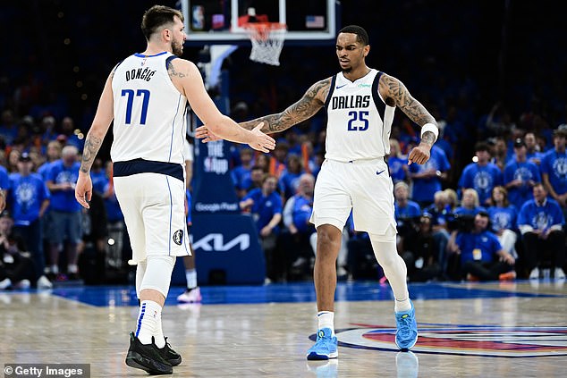 Doncic and PJ Washington (right) each scored 29 points as Dallas won on Thursday night.