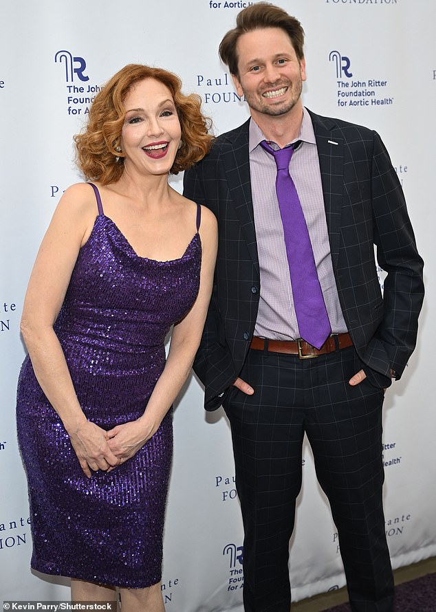 Amy, who was a 1990s comedy star on Wings, gave the affair a touch of showbiz dazzle in a purple sequin dress that complemented her orange curls.