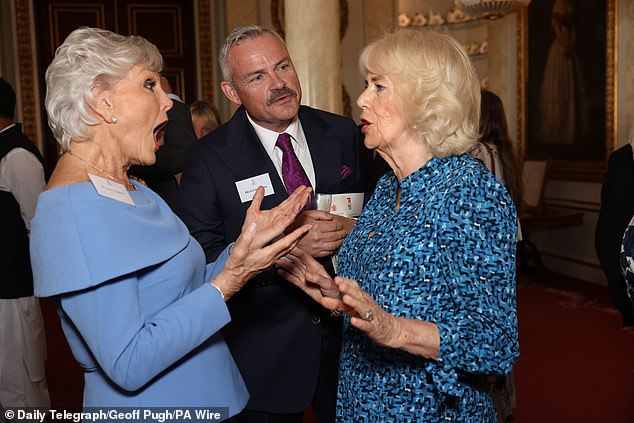 Queen Camilla was pictured speaking to Angela Rippon (right) as she hosted a reception to mark the 90th anniversary of animal charity Brooke.