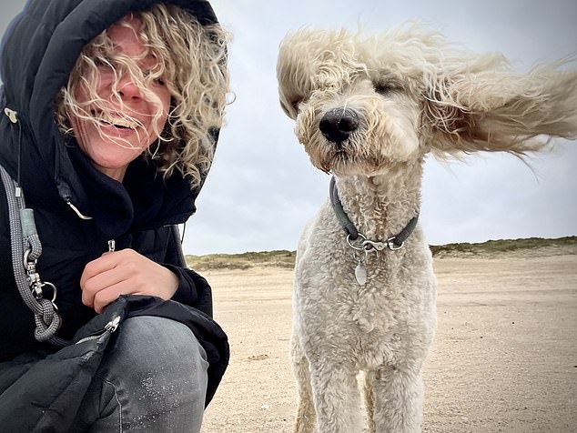 Julia Illig, Curls in the Wind... An owner and her dog look dramatically windswept during a day at the beach