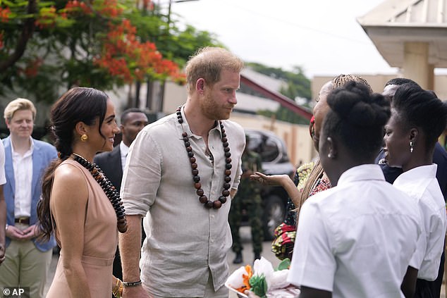 Both the duchess and the duke donned beaded necklaces, while Harry put on a low-key display in a cream shirt and pants combo.