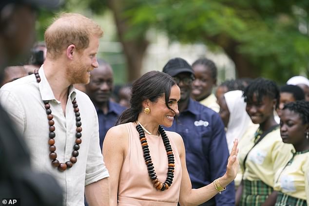 The Duke and Duchess of Sussex are welcomed at the Wuse Lightway Academy in Abuja today