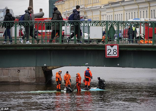 Searches are said to be continuing in the river after this morning's accident, and the bus remained submerged.