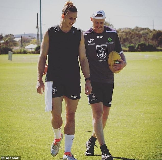 The 29-year-old (right) was able to reignite his AFL career when he joined Nat Fyfe (left) and the Fremantle Dockers.