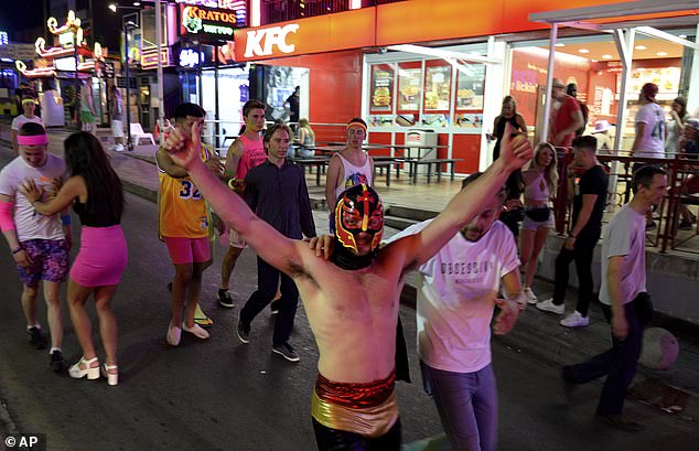 Tourists seen walking down the street in Magaluf