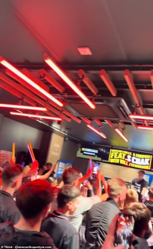 Fluorescent red lights line the walls and entrance of the Greggs branch as partygoers wave glow sticks and bounce in unison to a techno song mastered by DJ Charlie Boon.