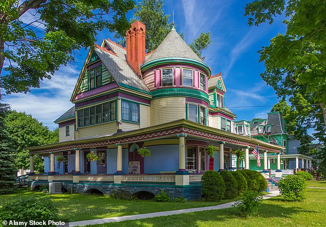 The city is surrounded by hills and rivers and has a population of 26,700 people. Pictured: The Christmas House store in a Queen Anne-style Victorian home in Elmira