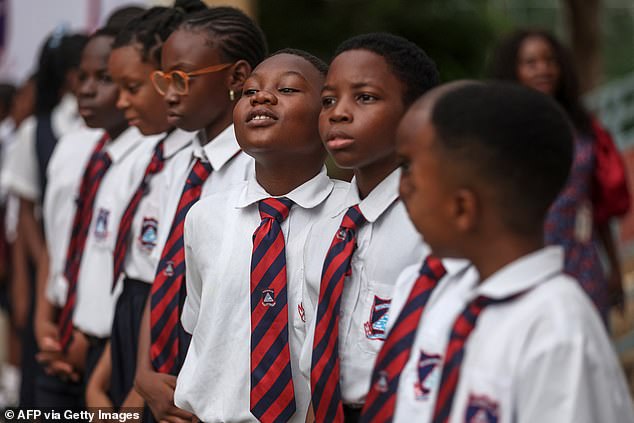 Children eagerly watched Harry and Meghan's visit to Wuse Lightway Academy in Abuja today