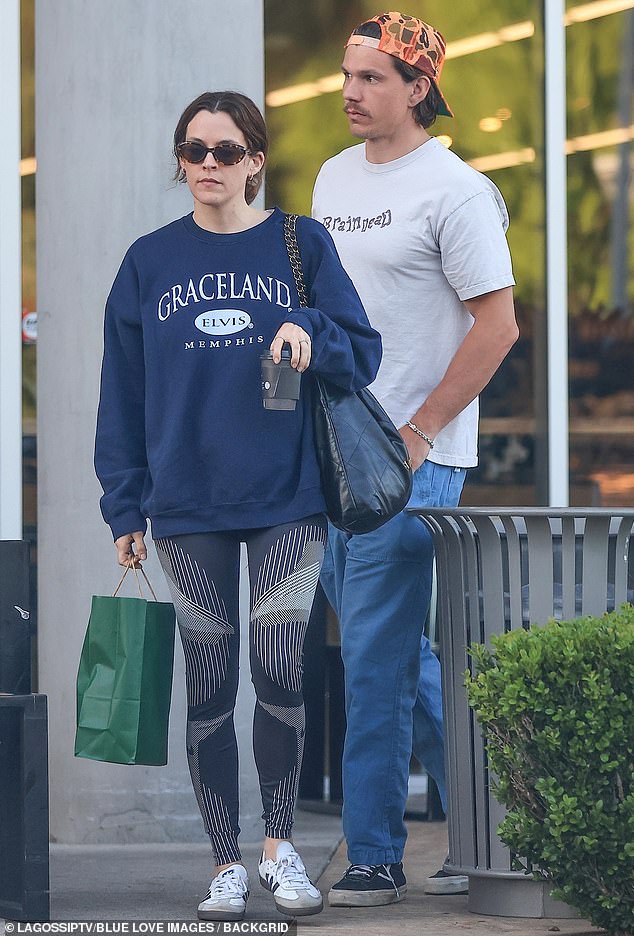 The 34-year-old actress kept it casual as she took a short walk after finishing her meal and wore a navy blue sweater with a logo bearing the name of her grandfather Elvis Presley's estate, Graceland.