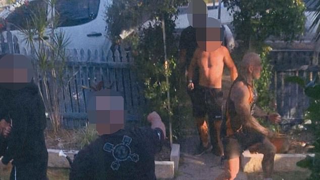 Footage handed to Gympie Magistrates Court shows the defendant arriving at Danny Hawkins' home, including an unidentified man in a black t-shirt who is an alleged witness.