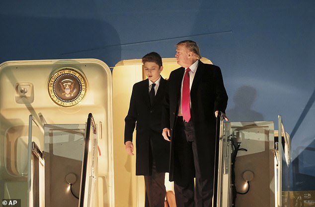 President Donald Trump and his son Barron Trump exit Air Force One in February 2020