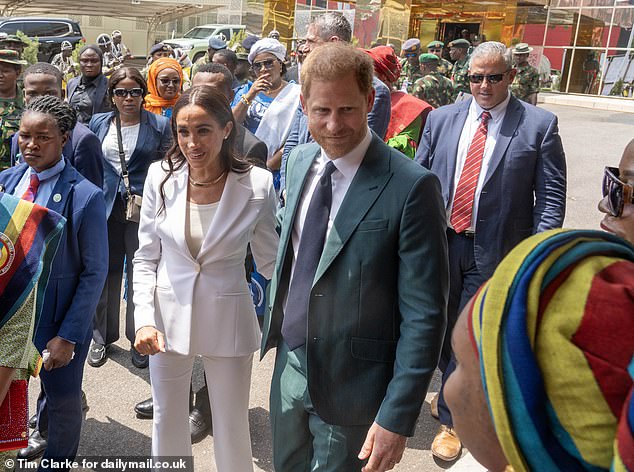 Harry and Meghan with their entourage of personal protection officers at Defense Headquarters in Abuja