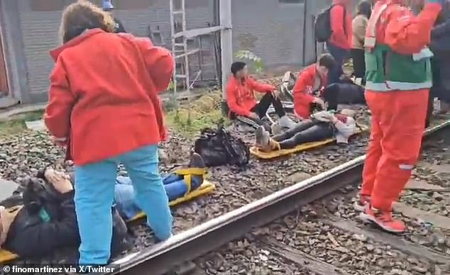 Paramedics treat injured passengers who suffered a train accident in Palermo, Argentina, on Friday