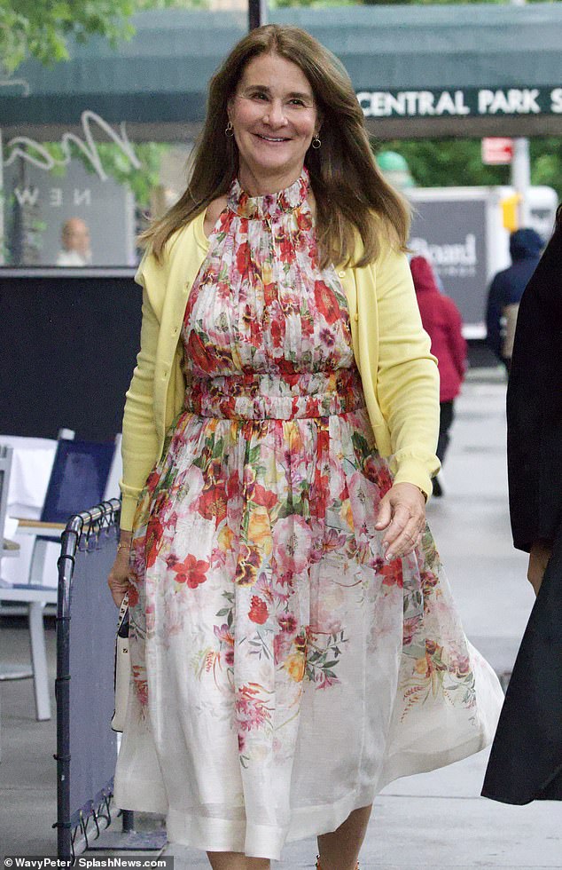 Melinda looked as stylish as ever as she rocked a mid-length floral dress with a pair of orange heels.