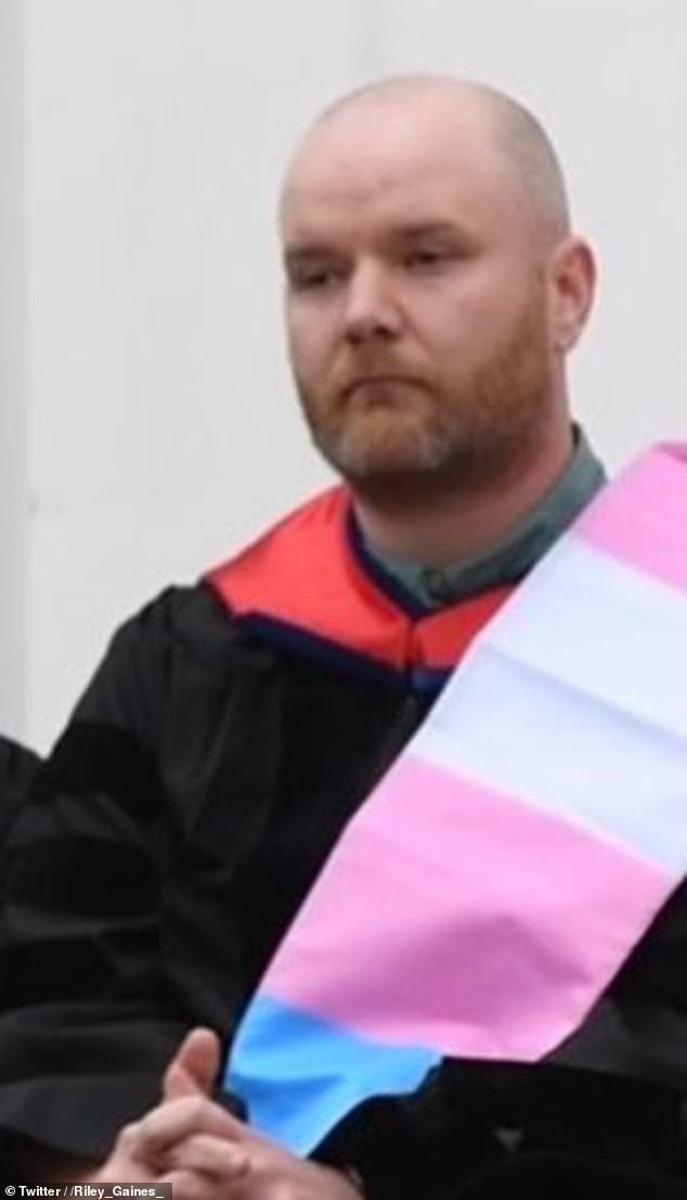 The administrator draped a trans flag over his shoulder in an apparent protest of Gaines' opposition to the inclusion of transgender athletes in women's sports.