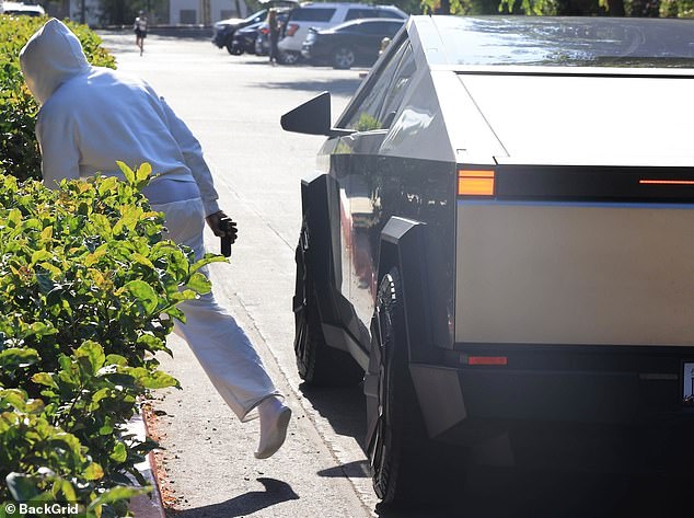 The rap star arrived at his son's basketball game in a shiny Tesla Cybertruck, pulled up by the hedges, and got straight out of the car toward the building.