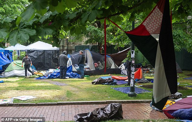 Maintenance staff and waste disposal crews clean up after police cleared a pro-Palestinian protest camp on the campus of the University of Pennsylvania in Philadelphia.