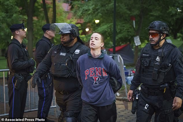 Police arrest a protester on the University of Pennsylvania campus in Philadelphia on Friday