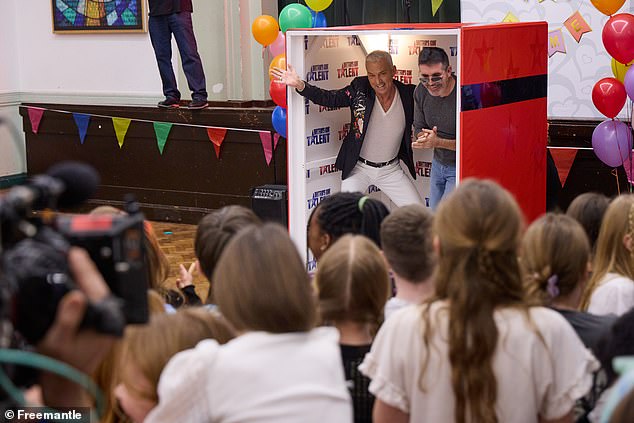 The couple hides inside a giant makeshift box and jumps towards the group of singers who have been having a party.